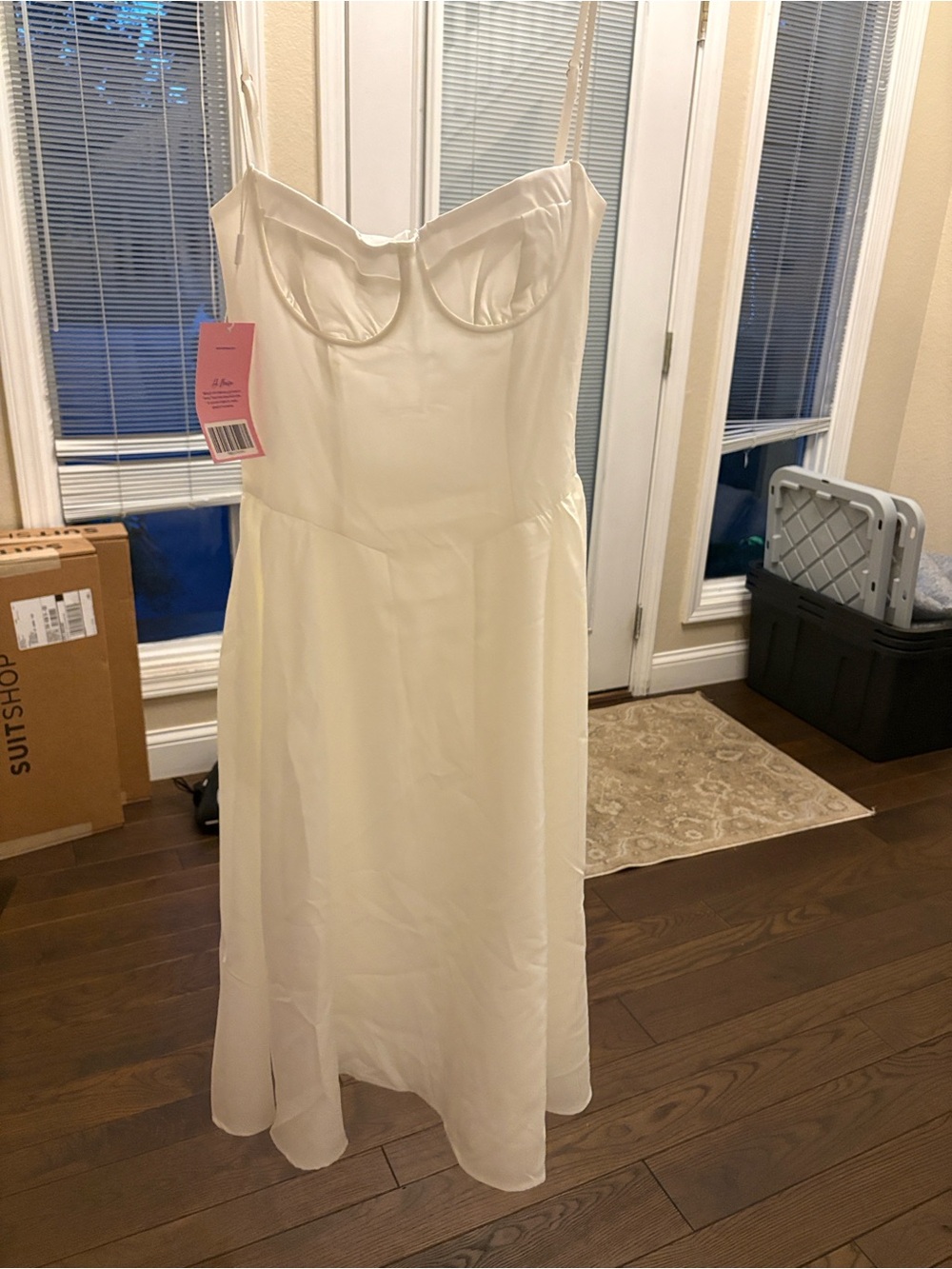 Almond Muse White Garment with Pink Brand Tag